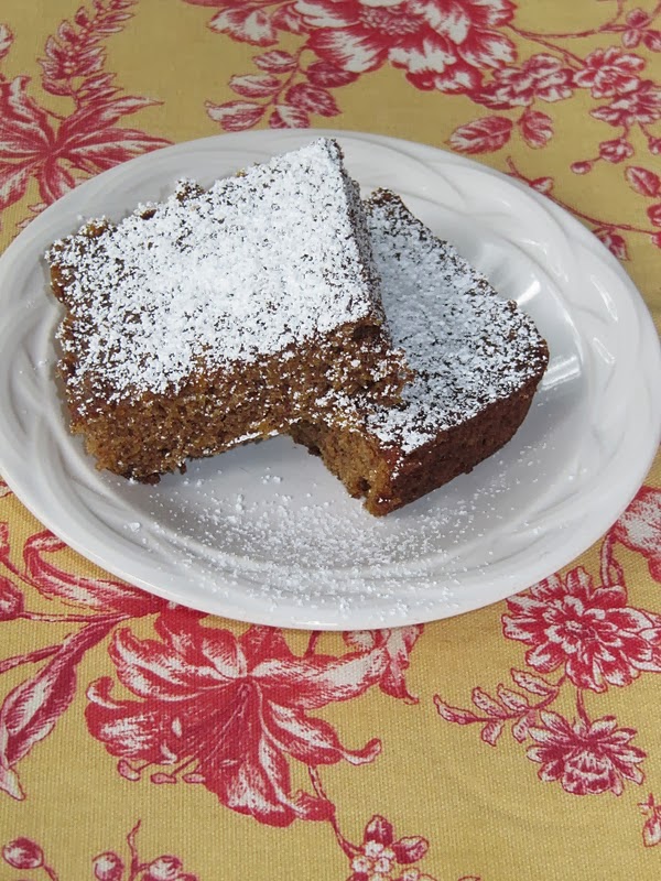 Butternut Squash Cake on a white plate sitting on a colorful place mat. 
