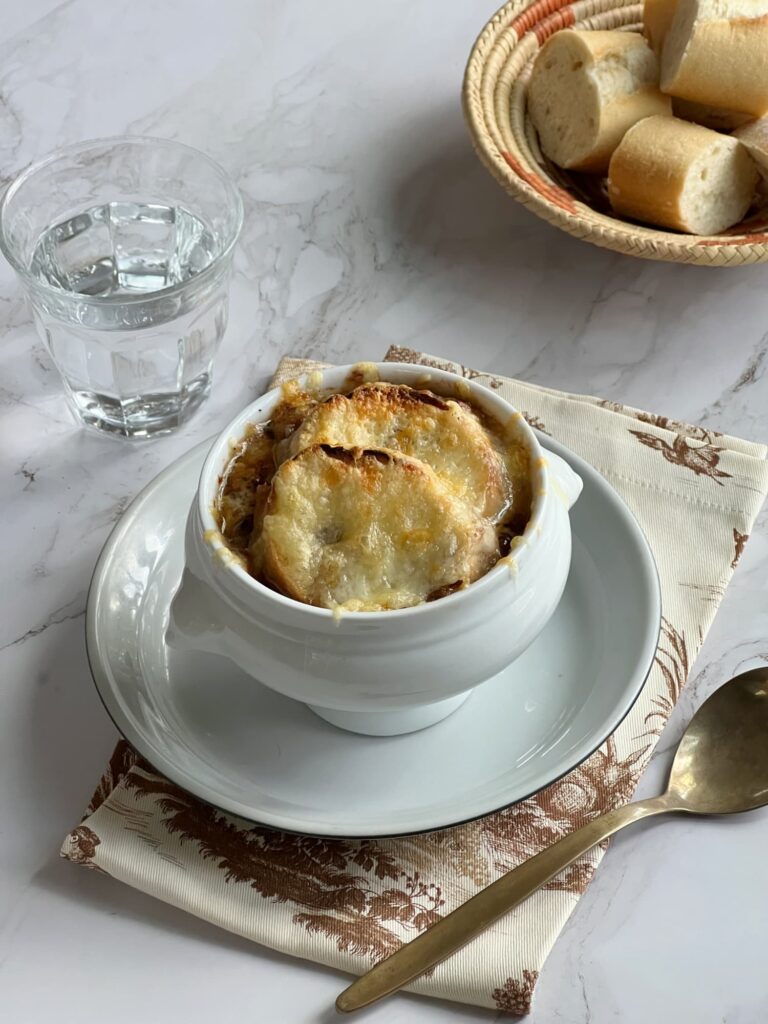 Classic French onion soup with toasted baguette and cheese