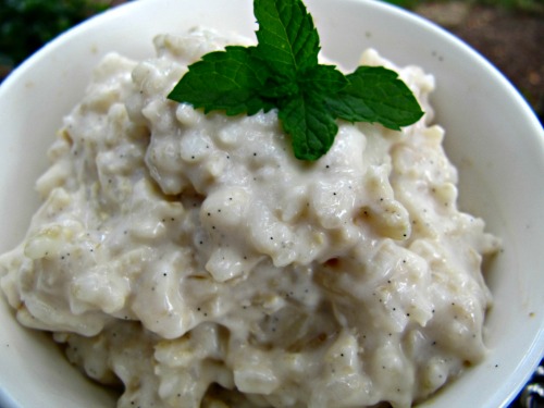 White bowl of vanilla bean rice pudding