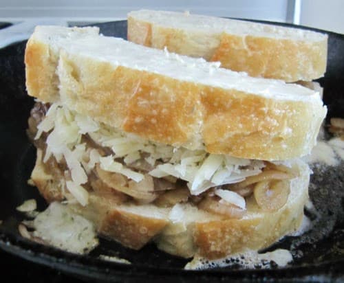 french-onion-grilled cheese cookin in a pan