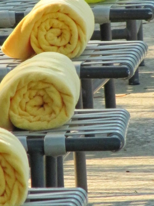 Long term relationship and intentional living after 50, three towels by the pool. 