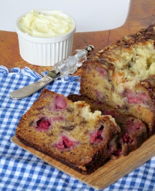 Raspberry banana bread with butter. 