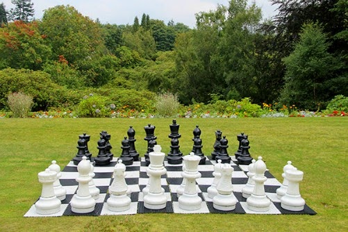 A large cheese board in an English garden. 