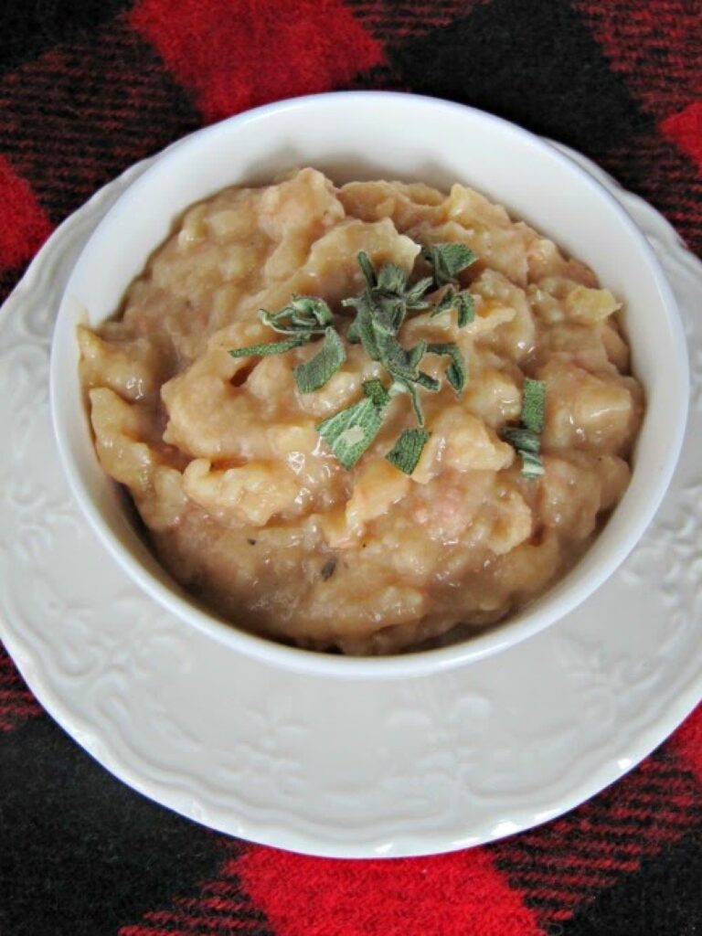 crockpot ham and bean soup in a white bowl