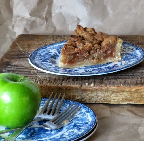 Harvest Apple Pie on a blue and white transfer ware plate with a green apple.