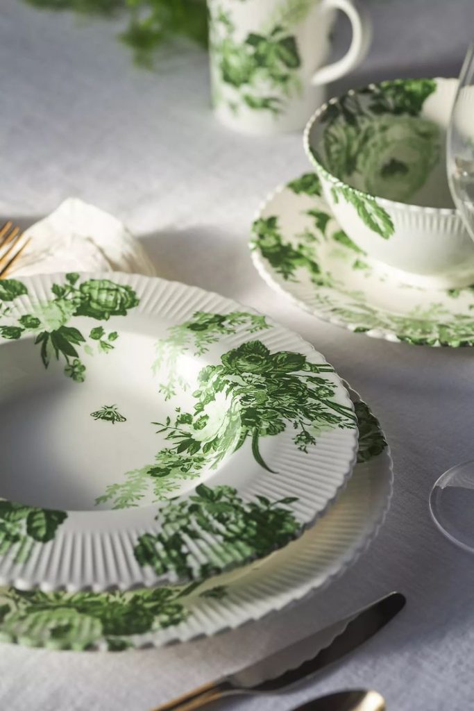 Green and white Dishes with flowers.