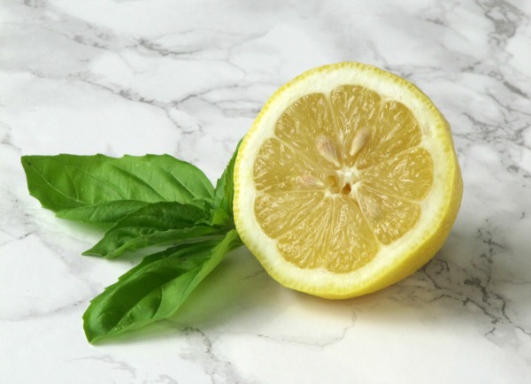 lemon half with a spring of basil.