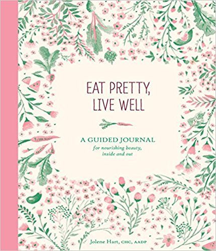 Eat pretty live well book cover, a guided journal with pink and green illustrations. 