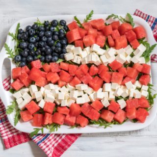 Fruit flag with watermelon, blueberries and cheese.