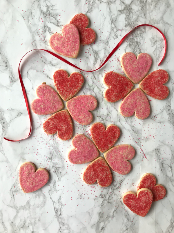 heart shaped cookies with red and pink sugar