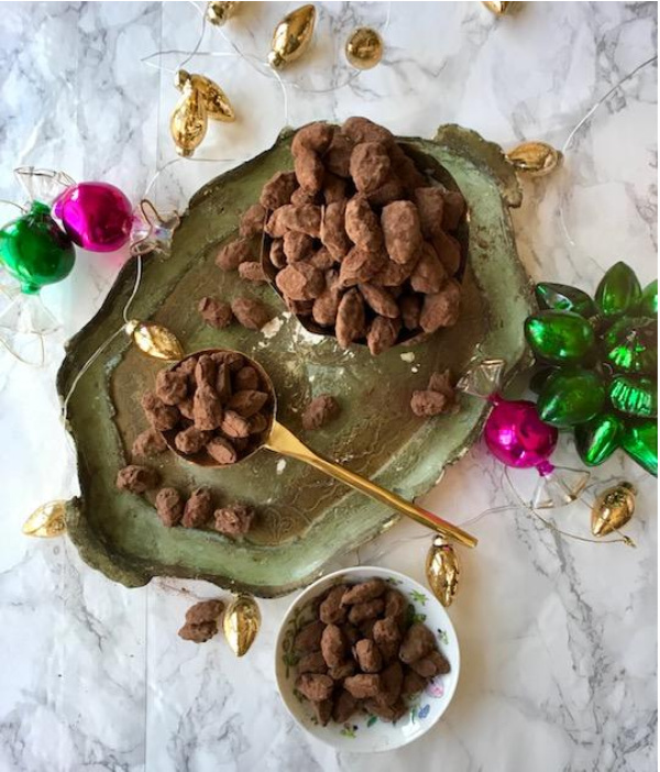 Mothers day gift idea chocolate almond-dragees candy on a Florentine tray with ornaments 