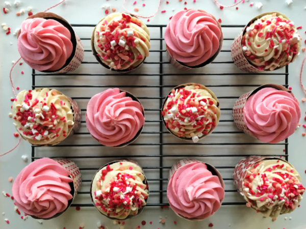 Easy and delicious Semi-homemade chocolate cupcakes with pink and white buttercream frosting and lots of sprinkles.