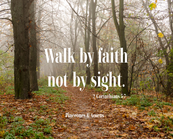 leaf path in a forest with the words walk by faith not by sight in white letters over the top