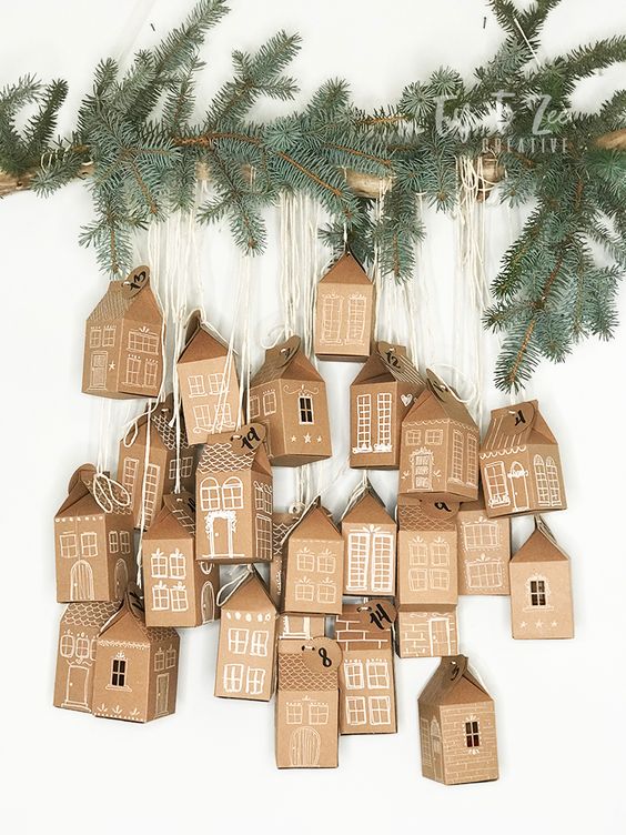 Brown cardboard houses decorated in white advent calendar