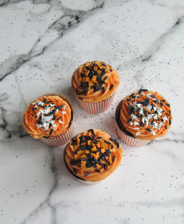 homemade carrot pumpkin cupcakes with sprinkles and sanding sugar