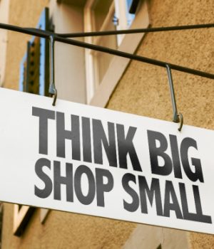 White sign that says think big shop small