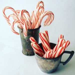 candy canes in silver bowls
