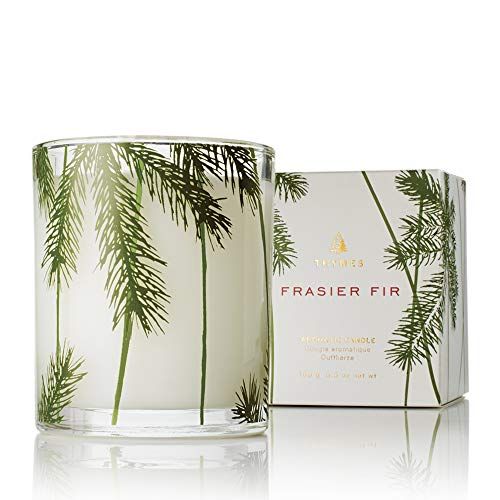 a white box with pine design and a candle that says Fraser fir