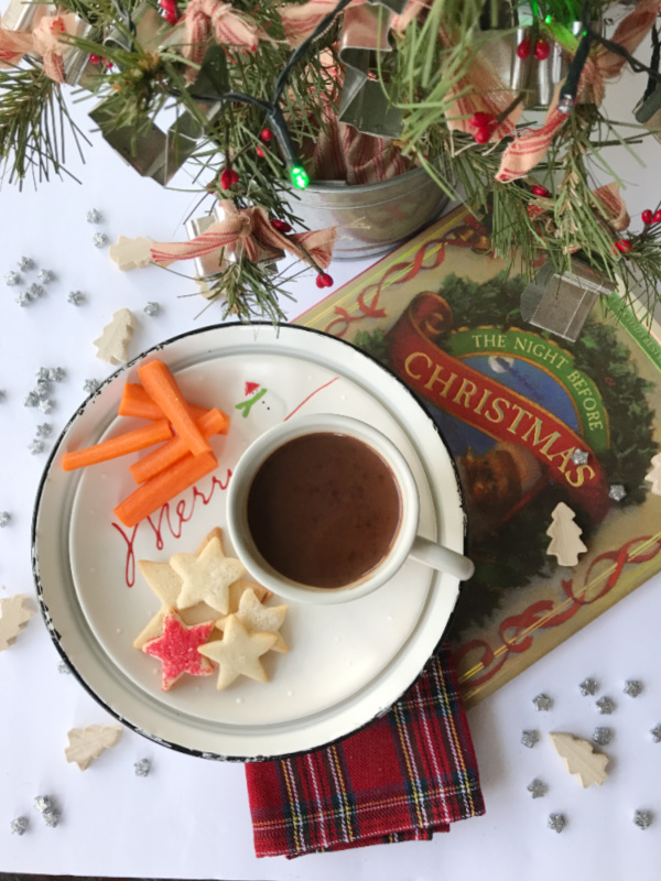 Twas the night before christmas book hot chocolate a christamas tree and a plate of cookies and carrots
