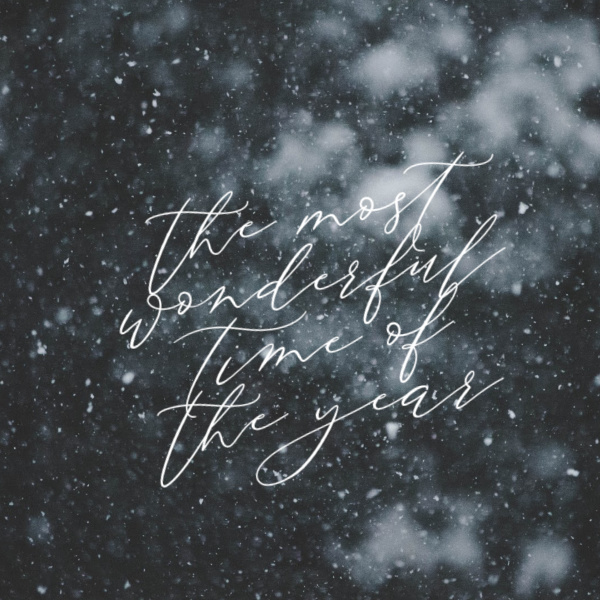 the most wonderful time of the year written over a snowy scene