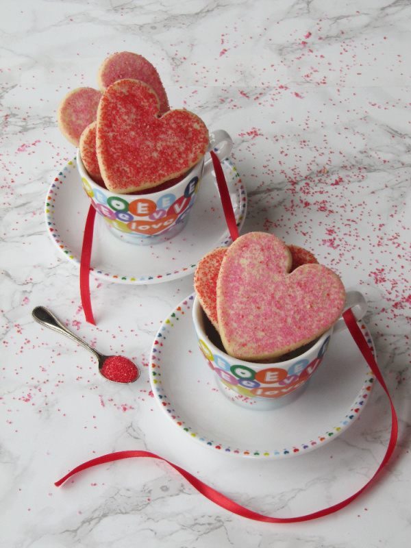 heart shaped sugar cookies in tea cups