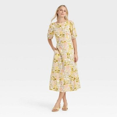 Woman wearing aFriday Favorites find yellow dress with flowers 