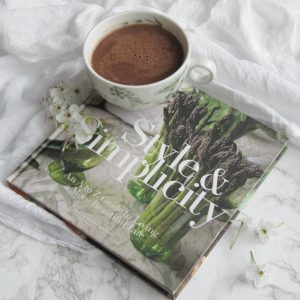 Friday Favorites Style and Simplicity Book By Watson Kennedy with a cup of hot chocolate