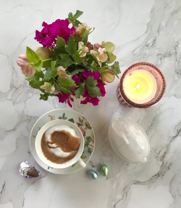 weekend meanderings Flatlay with floral arrangement and hot chocolate