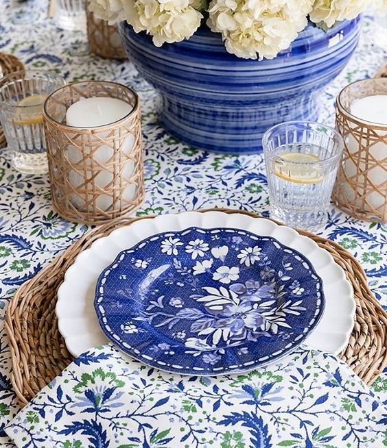Monday musings blue and white plate on a table with rattan accent pieces