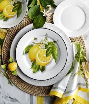 table setting with lemon plate and napkins