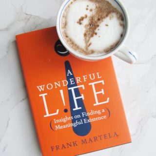 flatlay of hot chocolate and A wonderful life book frank Martela