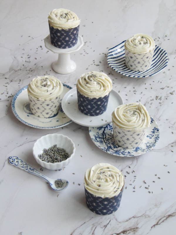 lavender cupcakes with butter cream frosting on blue and white vintage transfer ware