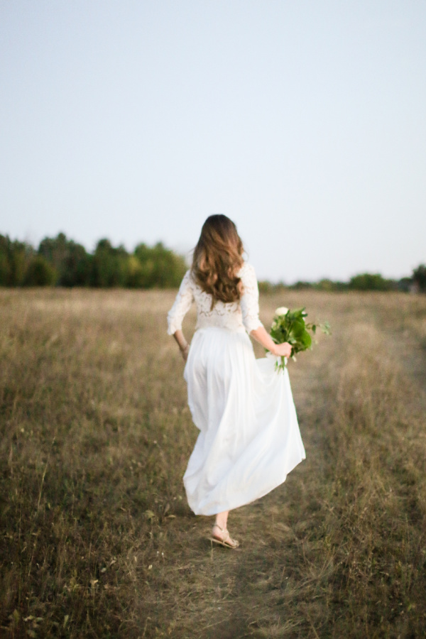 woman in a white dress in a field of flowers