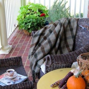 Fall porch with pumpkins and blankets