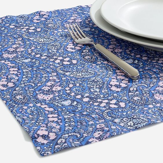table set with liberty blue print placemat and white plates