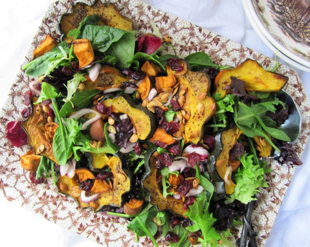 Acorn-squash-salad on brown and white platter