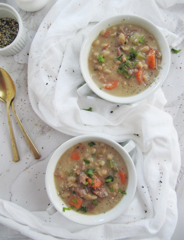 crockpot-ham-and-bean-soup in two white bowls 