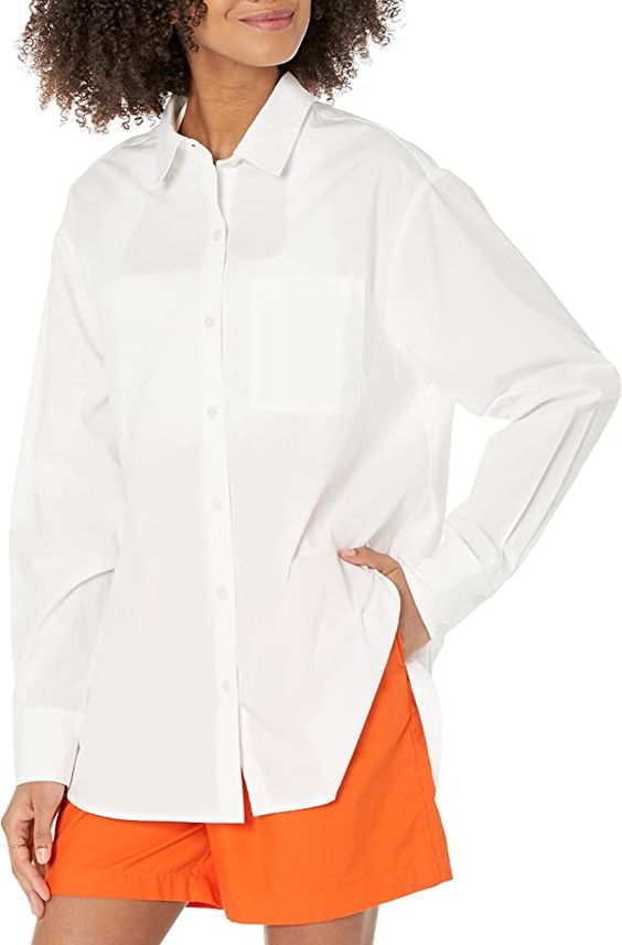 friday favorites woman wearing a white shirt and orange shorts
