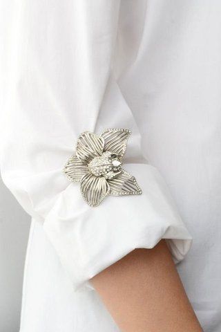brooch on a white blouse