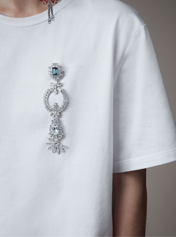 white t-shirt with brooch