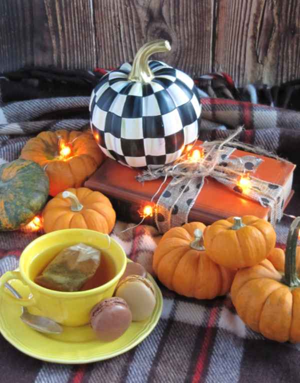 weekend meanderings orange pumpkins black and white pumpkin and a cup of tea in a yellow cut and saucer