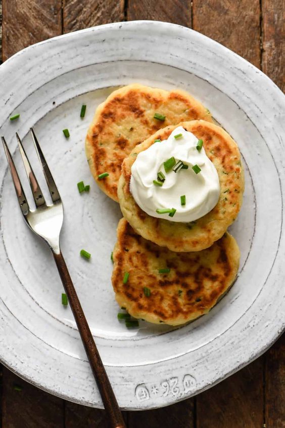 Mashed potato cakes with sour cream.