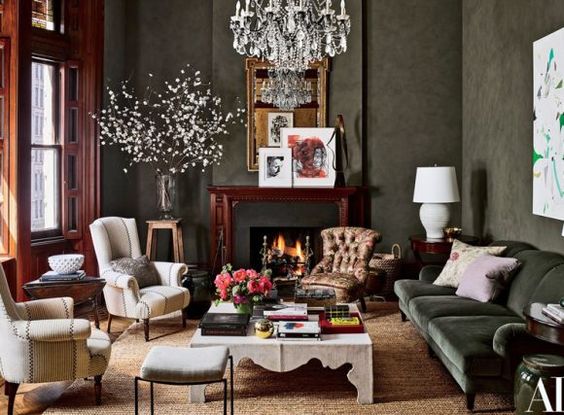 Sage green living room with leather chairs and couch. 