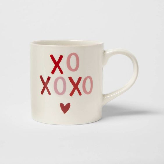 white mug with xoxoxox and a small heart. 
