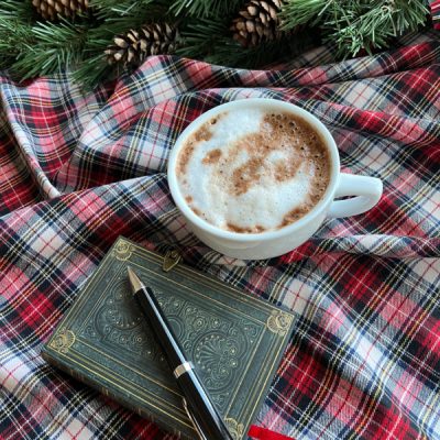 flatlay with hot chocolate and book