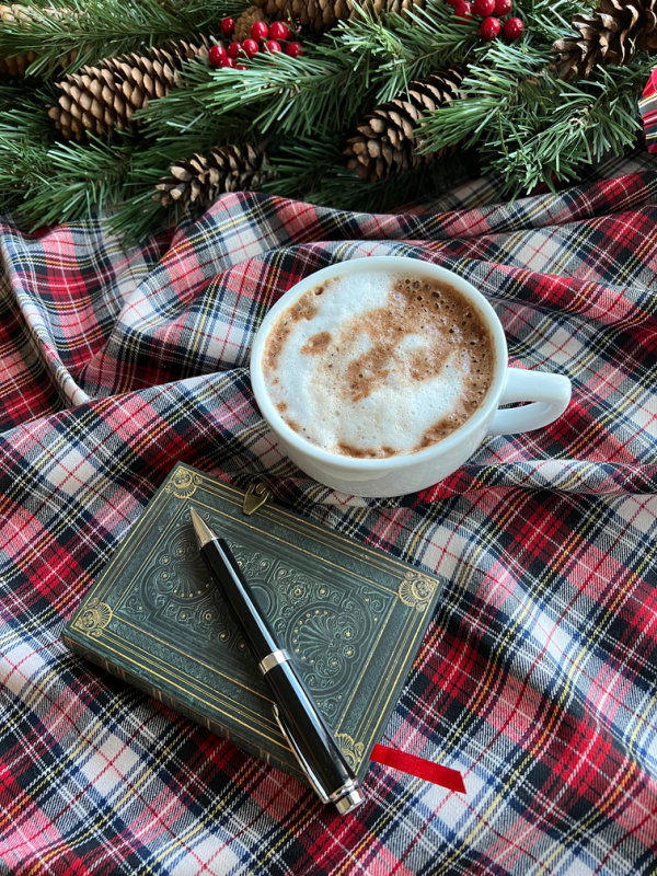 flatlay with hot chocolate and book