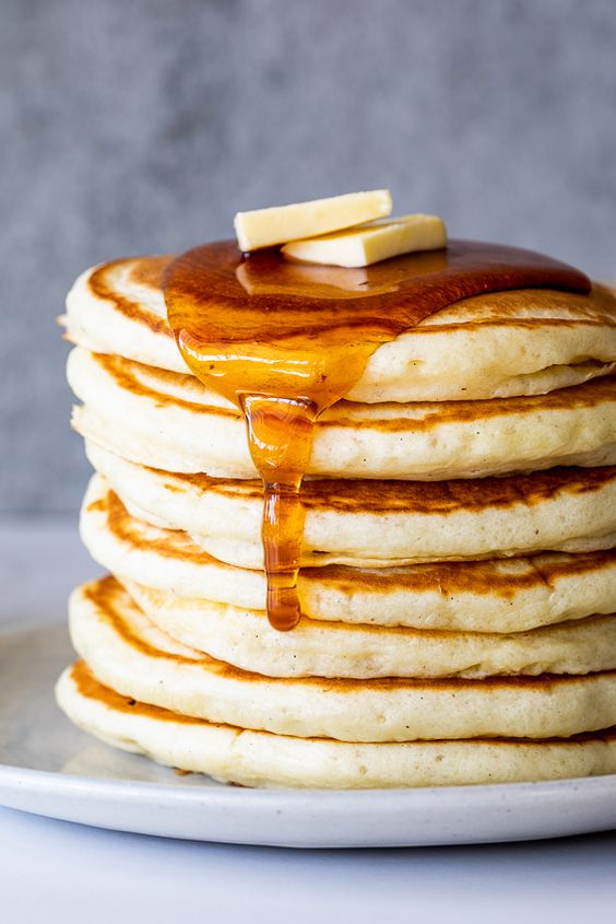 Buttermilk Pancakes, stack of 8 with butter pats and syrup. 
