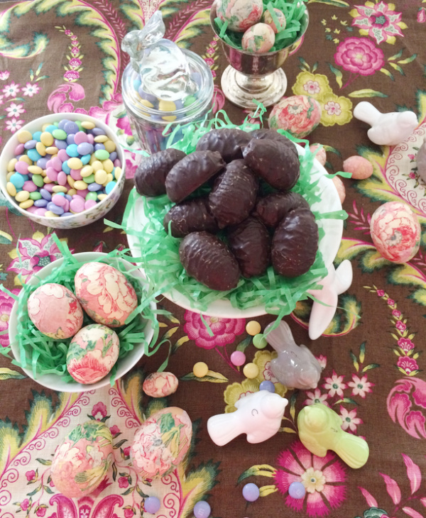 Easter tablescape candy, pastel colored candy, chocolate eggs. 