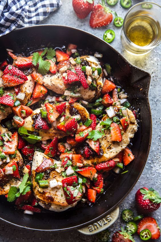 strawberry chicken in a cast iron skillet.