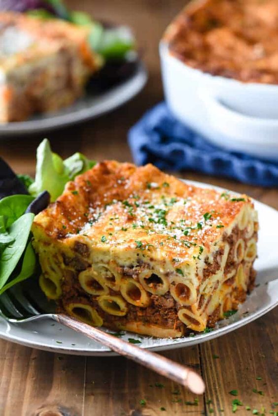 Greek lasagna on a white plate. 